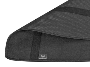 This anti-slip mat by Mercedes-Benz protects the boot floor during loading and unloading. Made from 100% polyester. Double-sided: with rubberised, non-slip side and high-quality velour side. Prevents cargo from sliding around. Protects the load compartment floor from dirt and damp. Easy to clean with warm water.