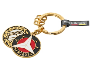 Sindelfingen key ring. Gold-plated brass. Flat split ring with three additional mini split rings for quick removal/replacement of individual keys. Made in Germany. Length approx. 9 cm.