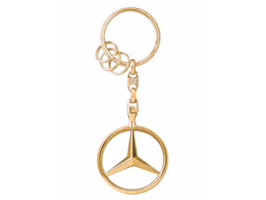 Brussels keychain. Die-cast zinc with high-sheen polished finish. Rotating Mercedes star. Split ring with three additional mini split rings for quick removal/replacement of individual keys. Length approx. 9 cm. Gold-coloured B6 695 3741. silver B6 695 7516.